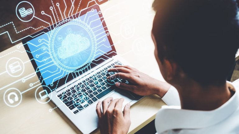 Person using a laptop with digital cloud computing and autism data analysis visuals, symbolizing understanding WHO autism data.