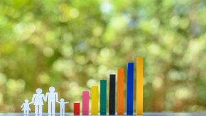 A symbolic representation of increasing autism rates with colorful bar graphs and a family figure, illustrating the rising prevalence of autism diagnoses.