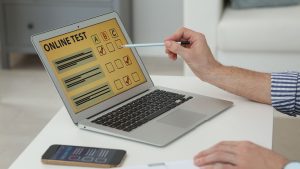 Person taking an online autism spectrum test on a laptop, highlighting the rise of digital screening tools for early self-assessment.